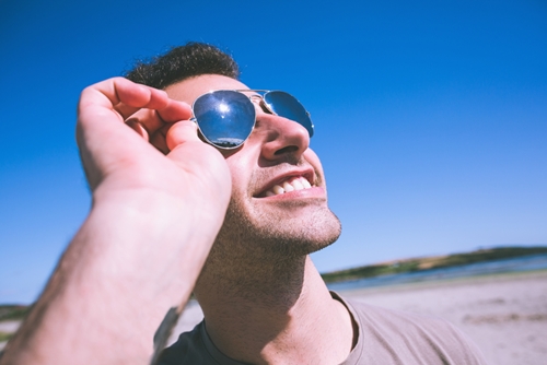 man with sunglasses looking up