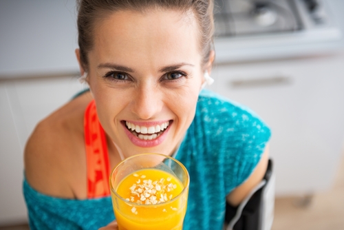 young woman's face with drink